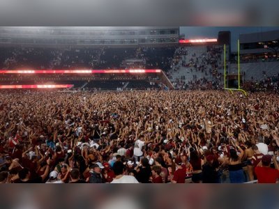 Florida State Fans Storm Field After Win Over Alabama