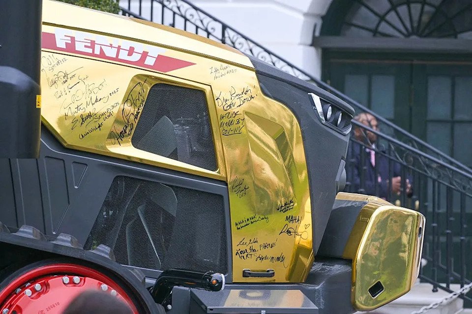 Trump Draws Attention at Event After Admiring Striking Gold Tractor Display