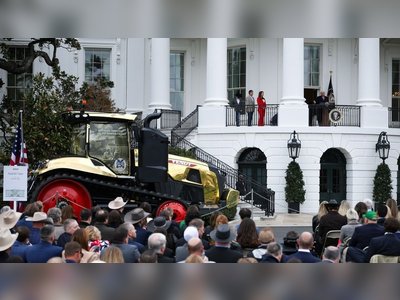 Trump Draws Attention at Event After Admiring Striking Gold Tractor Display